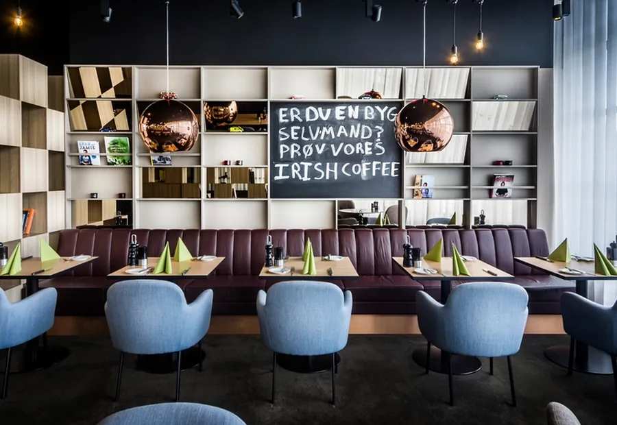 Modern restaurant interior with tables set for service